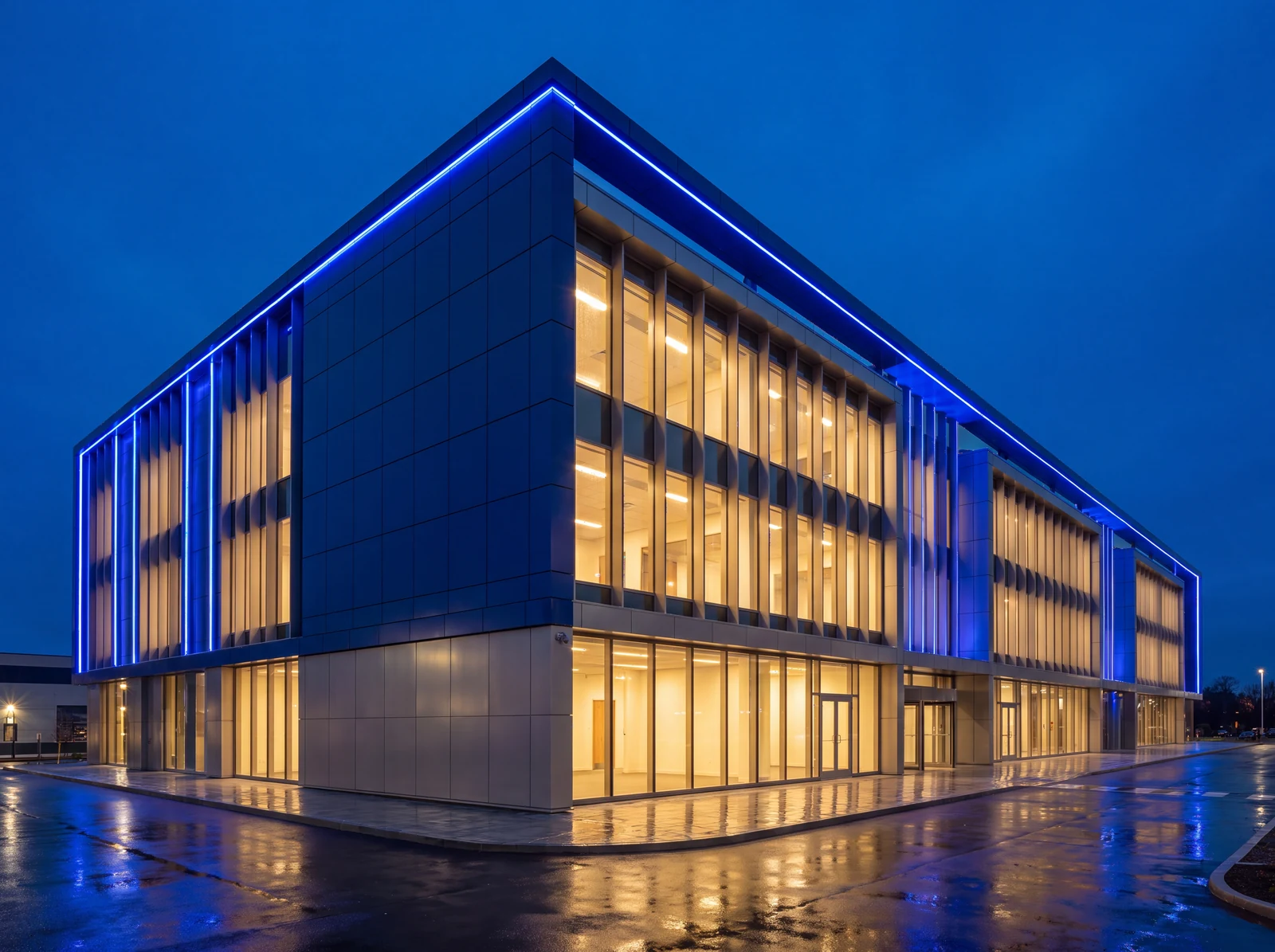 Modern commercial facility exterior at blue hour